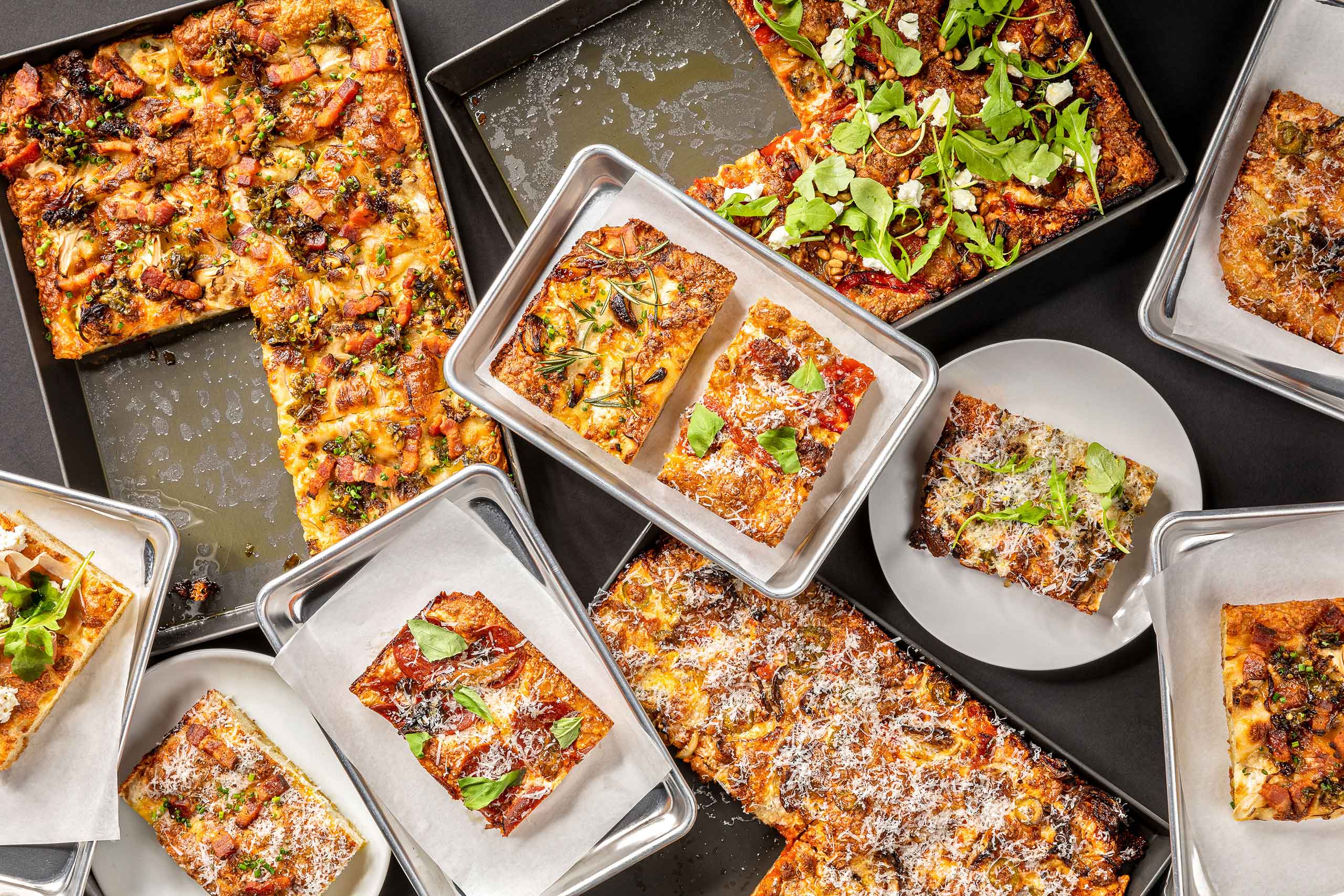 Overhead view of assorted pizzas