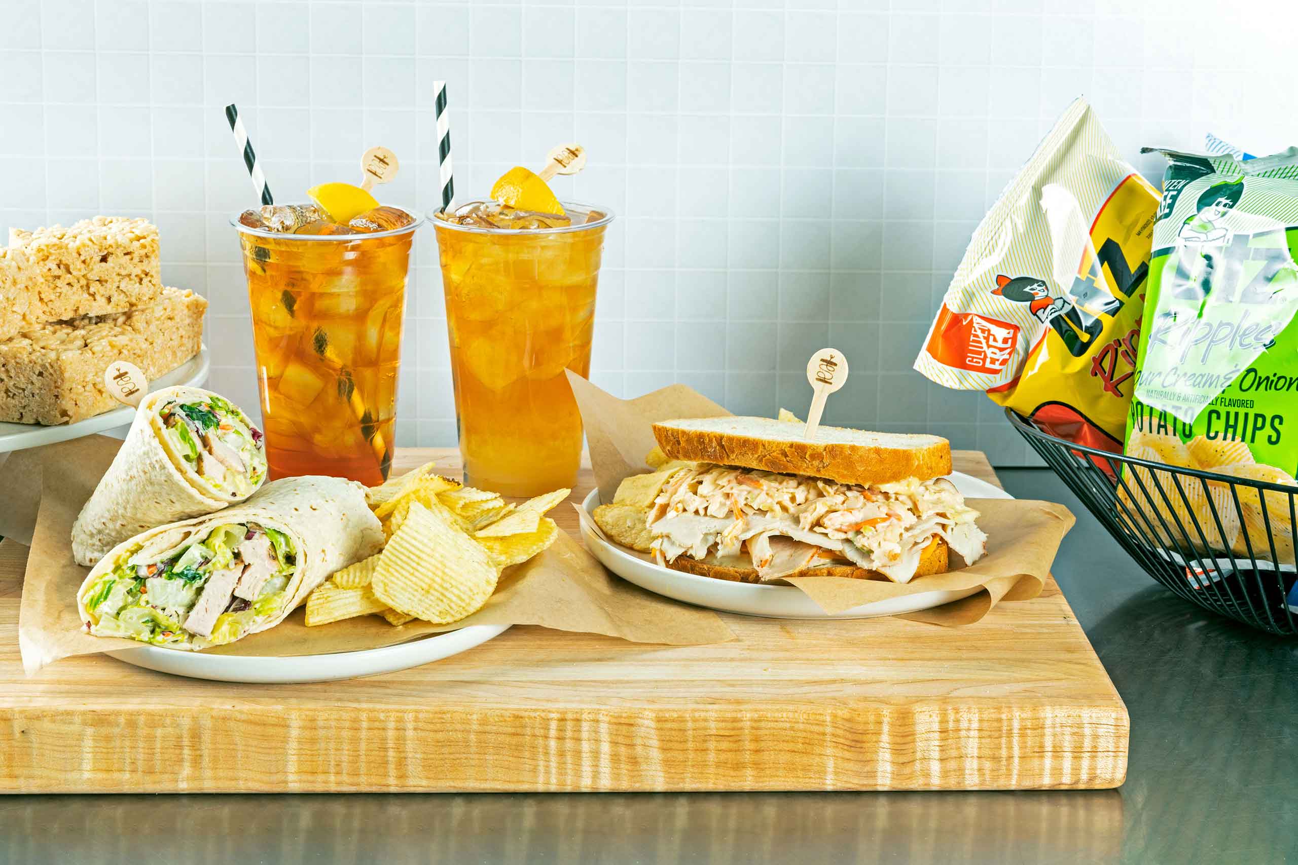 Assorted sandwich, wrap, chips and drinks